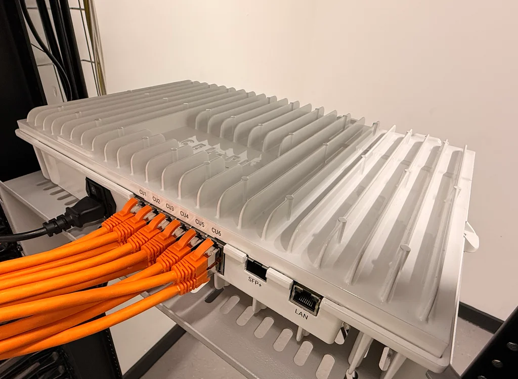 a photograph of a bunch of orange wires connected to a computer