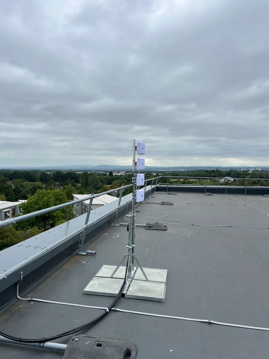 a photograph of a large metal roof with a sign on it
