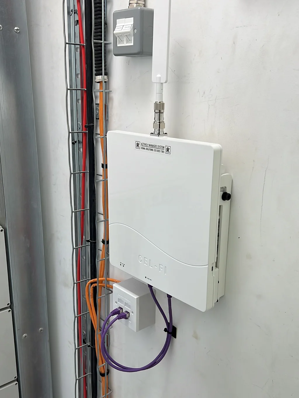 a photograph of a white tankless water heater with a white tank