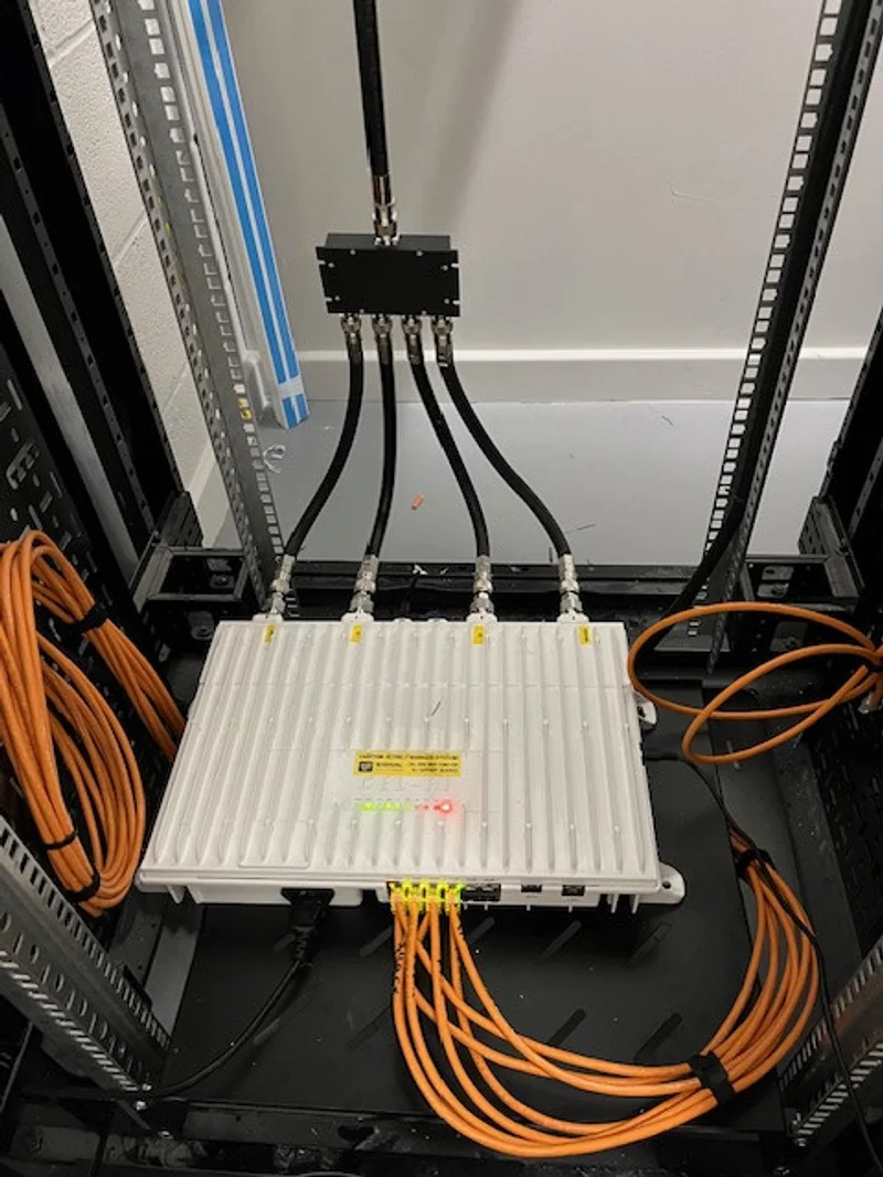 a photograph of a rack of cables and cables connected to a computer