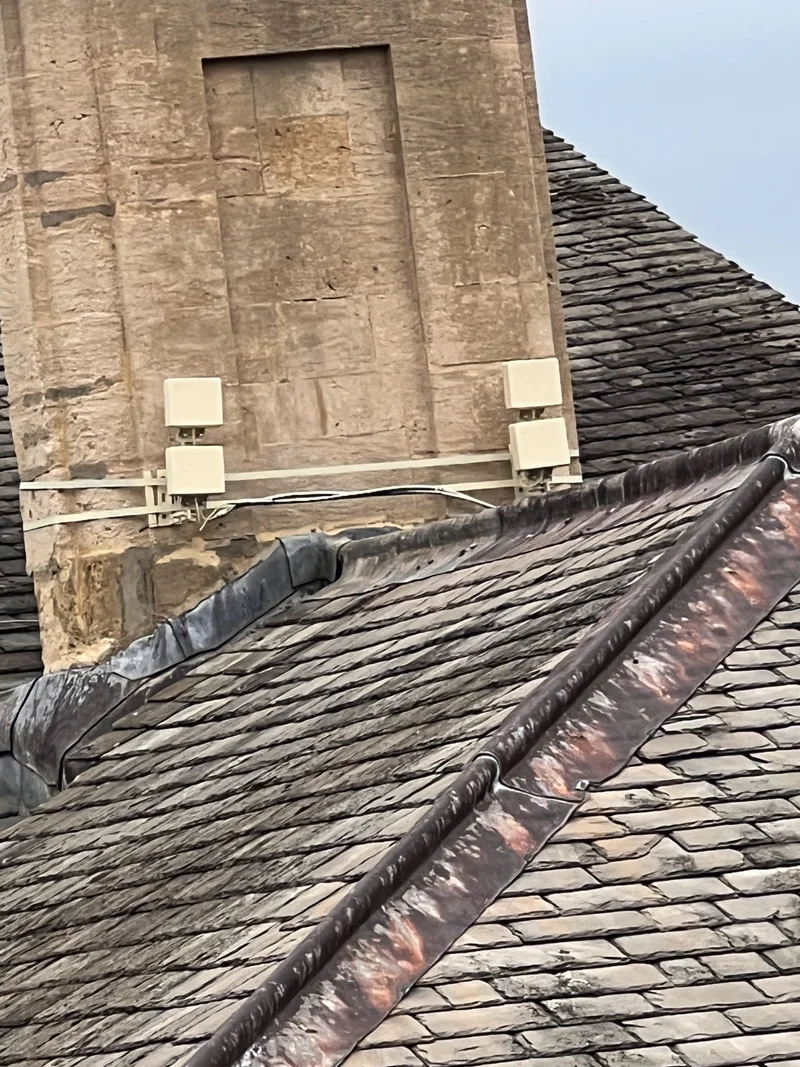 a photograph of a clock tower with a clock on top of it