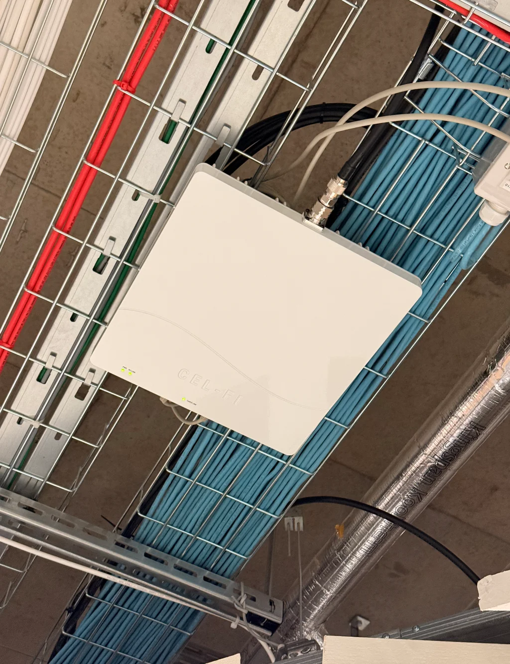 a photograph of a television antenna with a white box on top of it